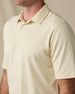Close-up of the Summer Sand Oxford Polo showing its classic collar, two-button placket, and textured knit fabric.