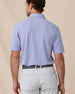Back view of the Oxford Polo in chambray blue featuring a clean silhouette and embroidered Straight Down logo at the neck