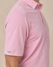 Sleeve tag detail of the Oxford Polo in punch pink