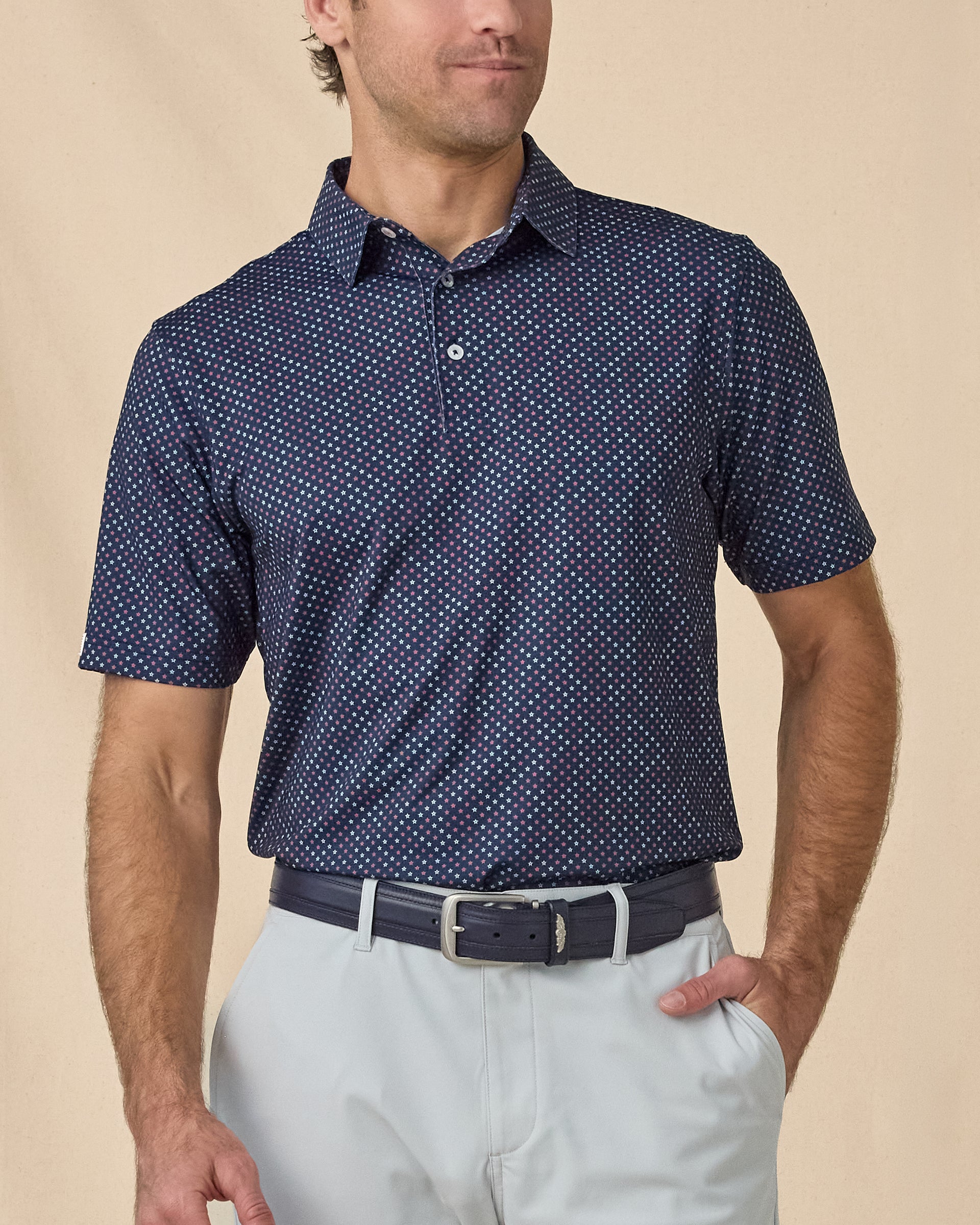 Star Struck Polo in New Indigo, front model view with light gray shorts