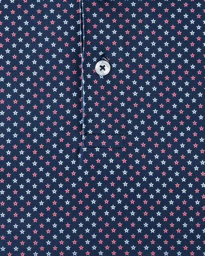 Close-up detail of the Star Struck Polo in New Indigo showing red and white, star pattern on performance fabric