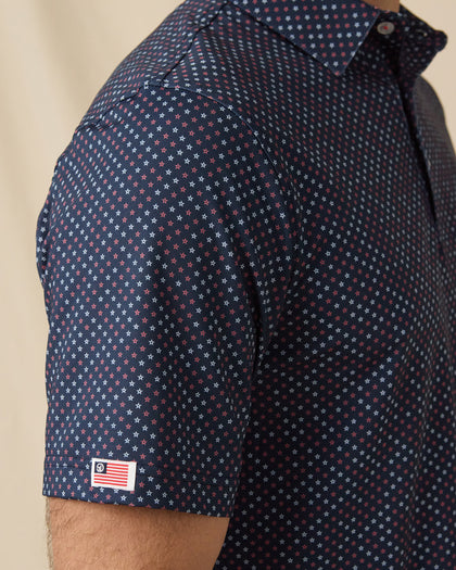 Star Struck Polo in New Indigo with sleeve flag logo detail close-up
