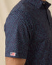 Star Struck Polo in New Indigo with sleeve flag logo detail close-up
