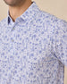 Close-up chest view of the Waterman Polo in Tidal Blue showcasing the detailed island-inspired tile print