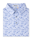 Waterman Polo in Tidal Blue featuring an allover island-inspired tile print, folded view