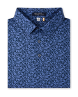 Tropics Lounge Polo in Tidal Blue with an allover tropical print, folded view
