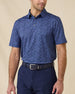 Model wearing the Tropics Lounge Polo in Tidal Blue, featuring a tonal tropical print