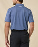 Back view of the Sarasota Polo in Moonlight showing the geometric print and embroidered logo below the collar.