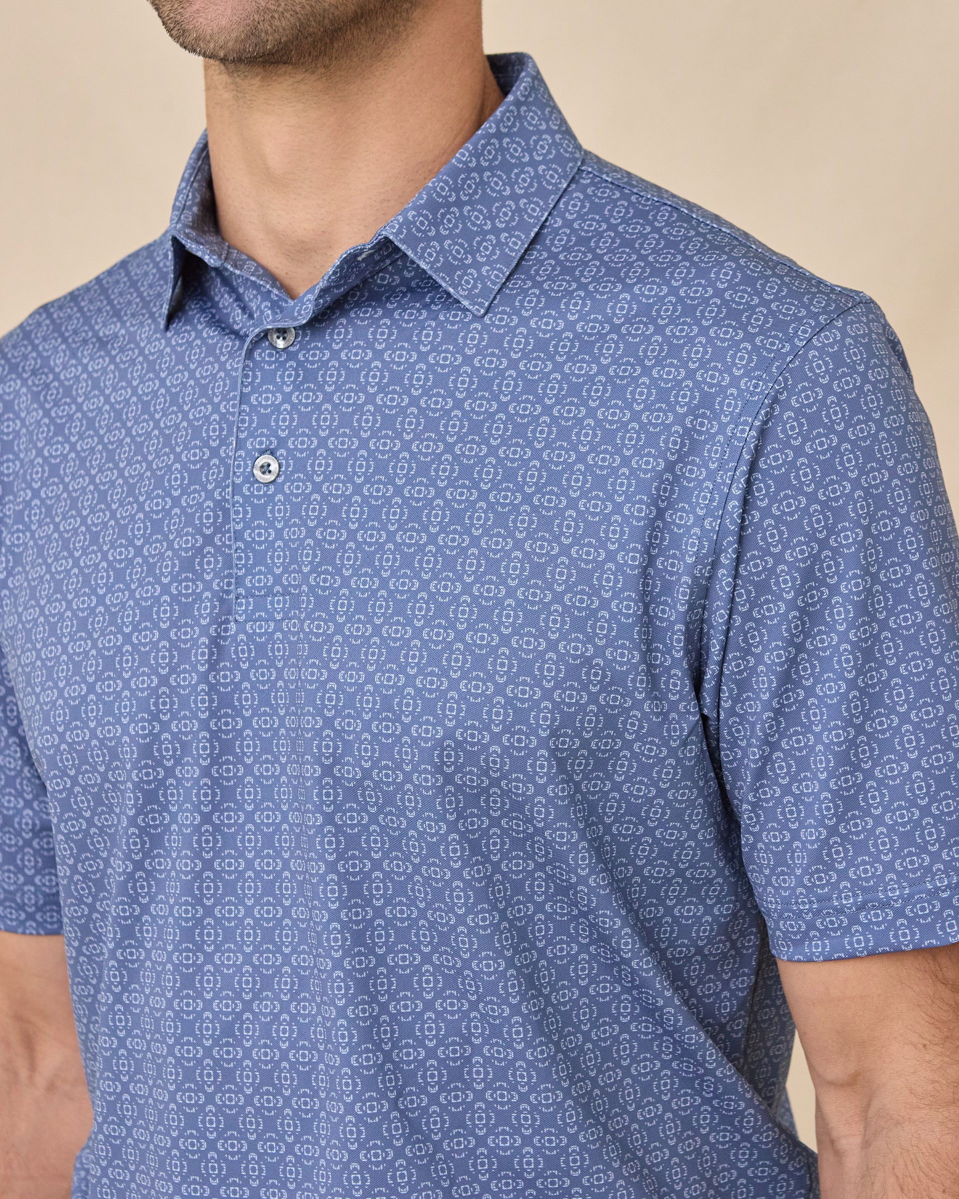 Close-up of the Sarasota Polo in Moonlight highlighting the geometric print, collar, and button placket.