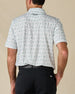 Rear view of the 29 Palms Polo in Herb, showing the palm print and embroidered logo below the collar.