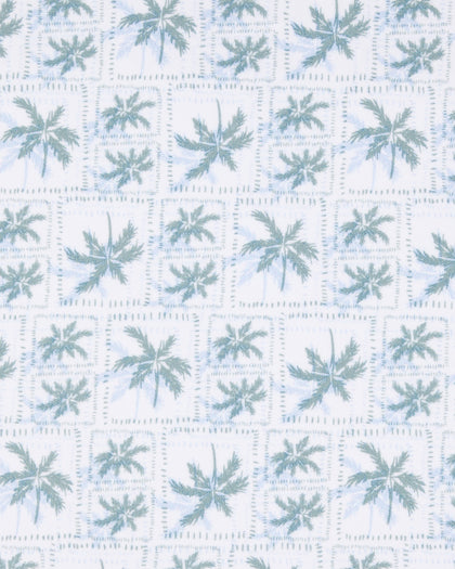 Close-up of the 29 Palms Polo in Herb showing the repeating light green palm tree print arranged in a subtle grid pattern.