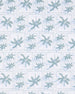 Close-up of the 29 Palms Polo in Herb showing the repeating light green palm tree print arranged in a subtle grid pattern.