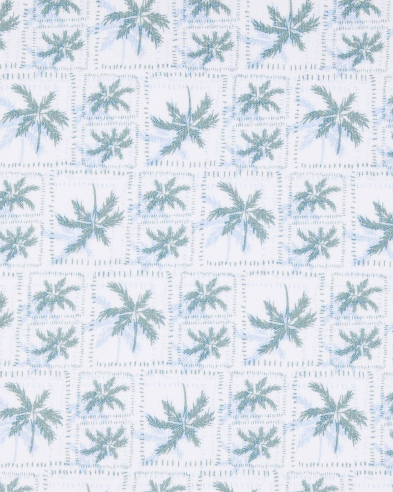 Close-up of the 29 Palms Polo in Herb showing the repeating light green palm tree print arranged in a subtle grid pattern.