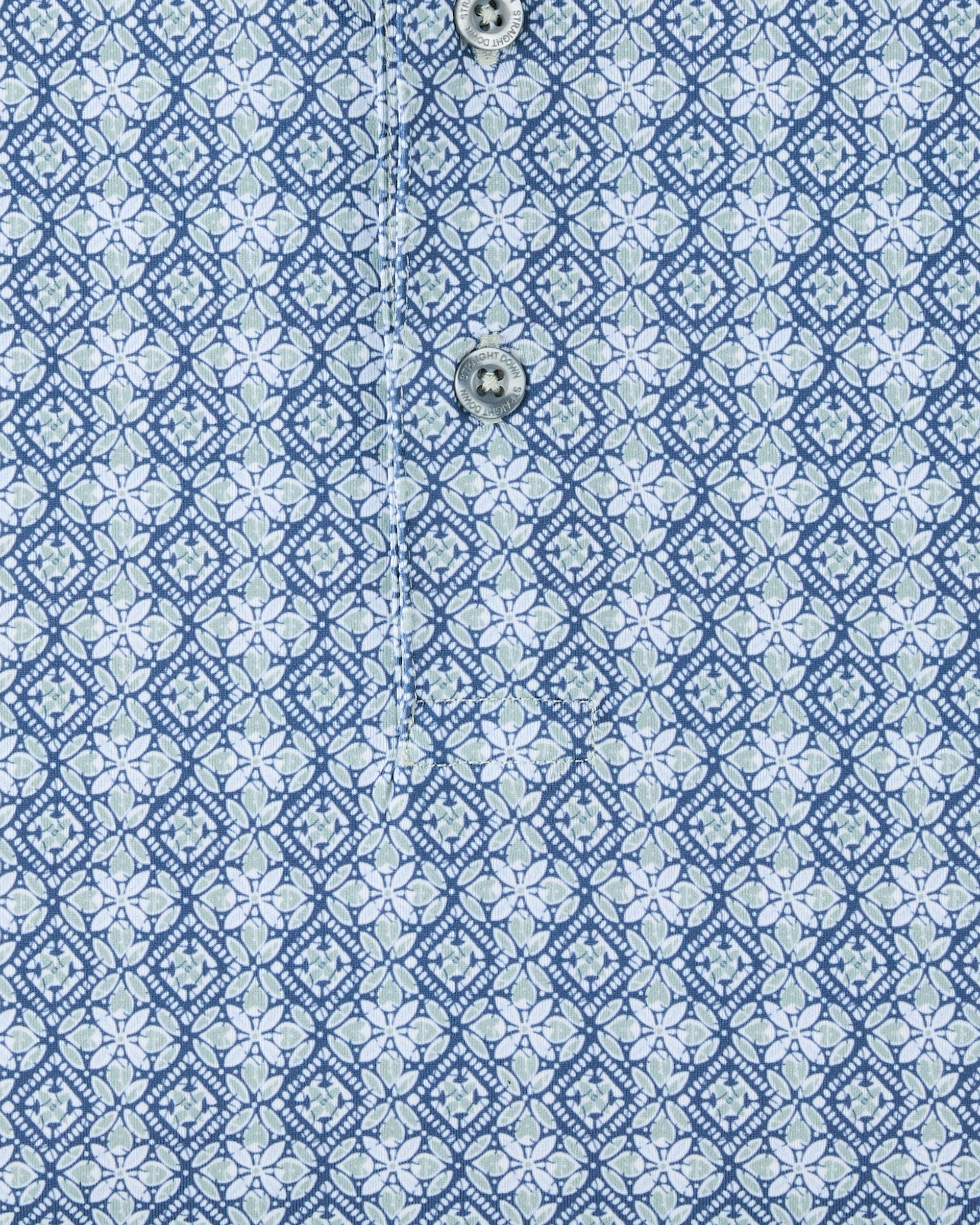 Close-up of the Grayhawk Polo in Moonlight highlighting the detailed geometric pattern and button placket.