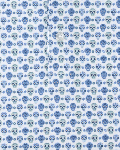 Close-up of the Day of the Dead Polo fabric highlighting the repeating blue and green sugar skull pattern.