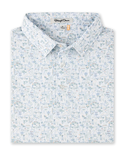 Route 66 Polo in Herb featuring an all-over illustrated print inspired by classic roadside landmarks, cars, palm trees, and desert scenery.