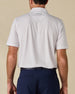 Back view of the Pink Flamingo Polo in Sea Shell, highlighting the all-over flamingo print and embroidered logo below the collar.