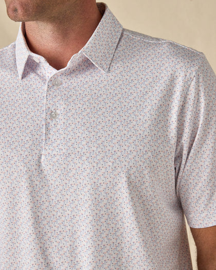Close-up of the Pink Flamingo Polo in Sea Shell, highlighting the miniature flamingo print, classic collar, and button placket.
