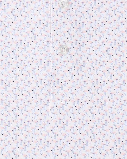 Close-up of the Pink Flamingo Polo in Seashell, highlighting the detailed pink flamingo print with light blue legs, navy accents, and branded button detail.
