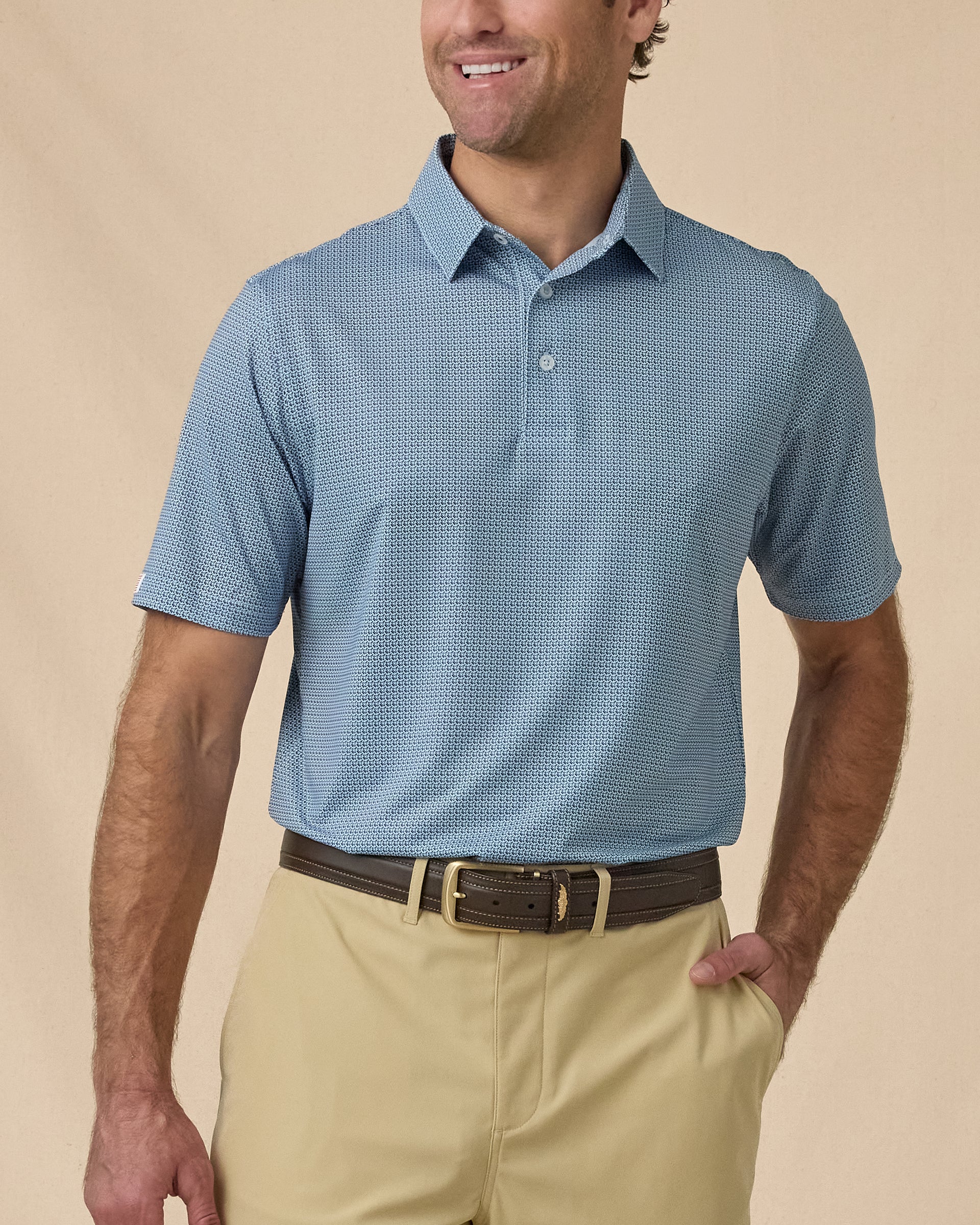 F-16 Polo in Nantucket Blue, front model view with khaki shorts