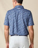 Back view of the Reef Runner Polo in Blue Shade, highlighting the detailed allover print and embroidered Straight Down logo below the collar.