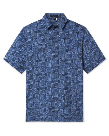 Front product view of the Reef Runner Polo in Blue Shade, featuring a tonal blue patchwork print, self collar, and short sleeves.