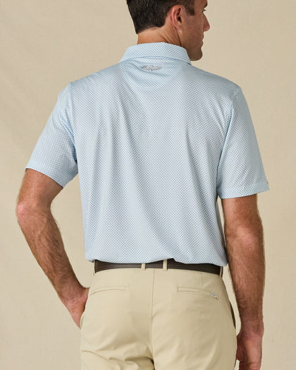 Back view of the Check Mate Polo in Mint Tea, highlighting the all-over print and embroidered logo below the collar.