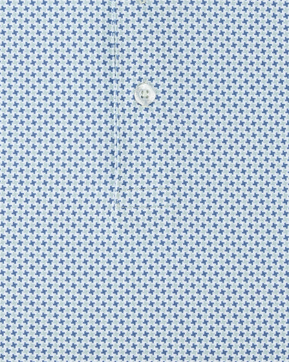 Close-up of a light blue and white micro-patterned fabric with a single white button at the center.