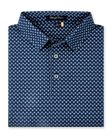 Folded Banksville Polo in New Indigo, featuring a repeating light blue geometric print, self collar, and button placket.