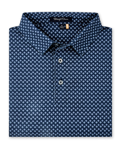 Folded Banksville Polo in New Indigo, featuring a repeating light blue geometric print, self collar, and button placket.