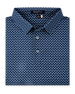 Folded Banksville Polo in New Indigo, featuring a repeating light blue geometric print, self collar, and button placket.