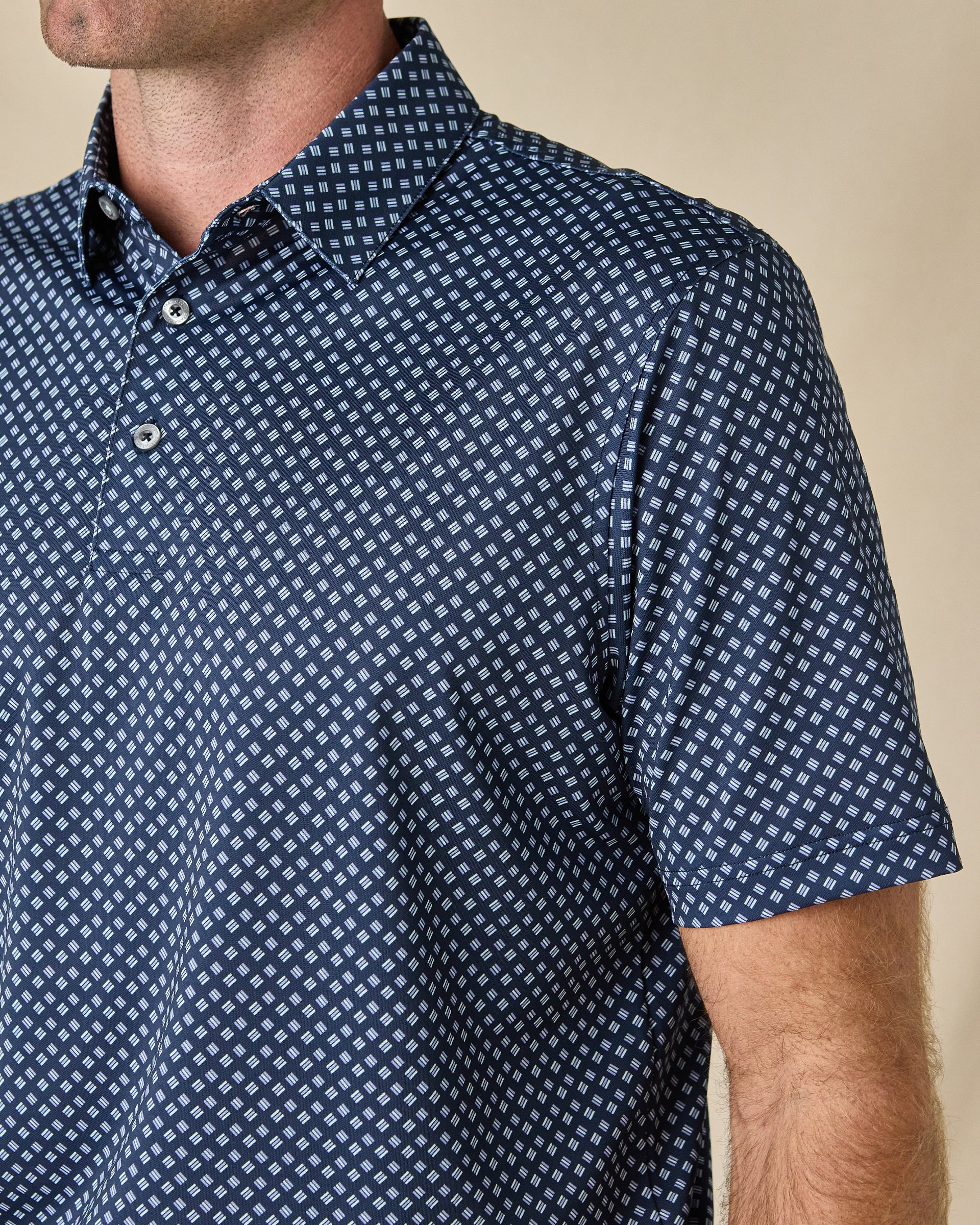 Close-up of the Banksville Polo in New Indigo highlighting the collar, buttons, and geometric print.