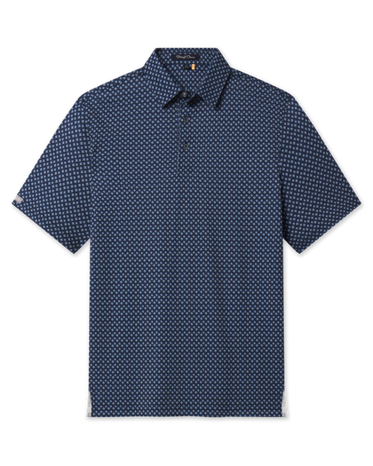Front product view of the Banksville Polo in New Indigo, featuring an allover light blue geometric print and short sleeves.