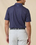 Rear view of the Banksville Polo in Tidal Blue featuring the allover geometric pattern and embroidered Straight Down logo below the collar