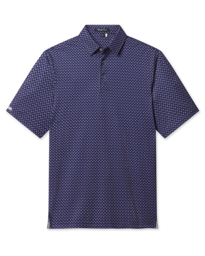 Banksville Polo in Tidal Blue featuring a navy base with a refined pink geometric pattern and short sleeves, front view