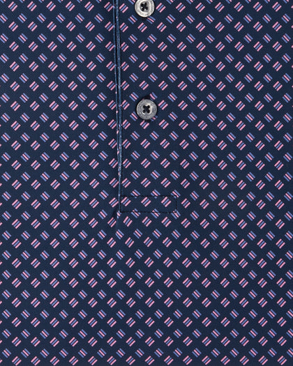Close-up of the Banksville Polo in Tidal Blue highlighting the pink geometric pattern