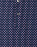 Close-up of the Banksville Polo in Tidal Blue highlighting the pink geometric pattern