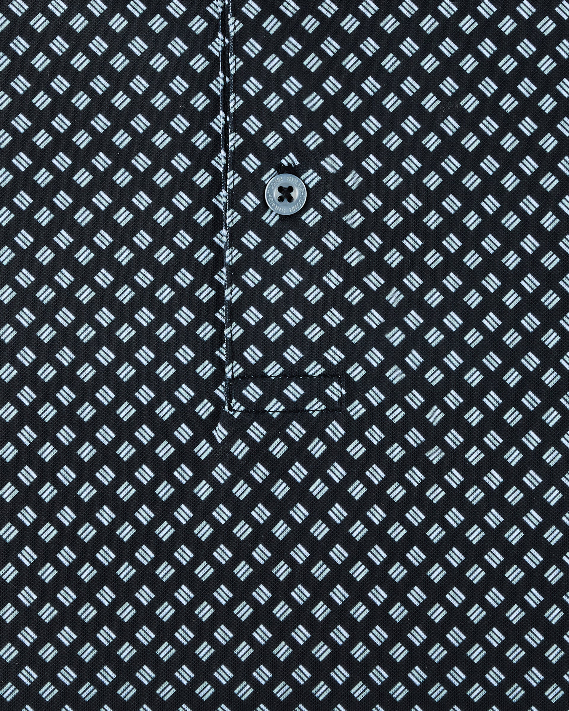 Close-up of the Banksville Polo in Black showing the light blue geometric print, placket stitching, and button detail.