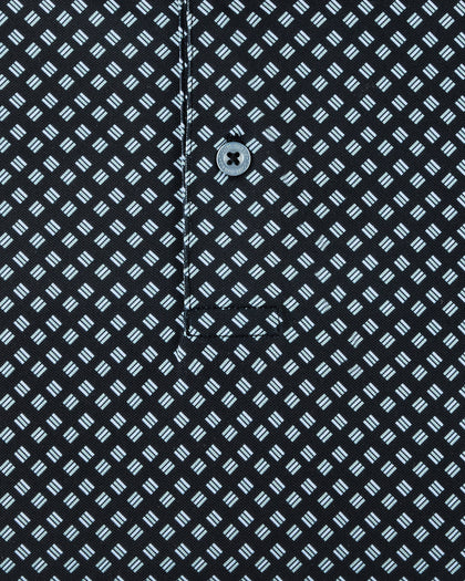 Close-up of the Banksville Polo in Black showing the light blue geometric print, placket stitching, and button detail.