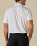 Rear view of the Brookhurst Polo in Herb, showing the small-scale geometric print and embroidered logo below the collar.