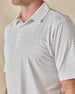 Close-up of the Brookhurst Polo in Herb, highlighting the refined geometric print and classic polo collar.
