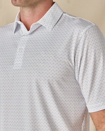Close-up of the Brookhurst Polo in Mint Tea, highlighting the small geometric print, structured collar, and button placket.