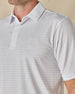 Close-up of the Brookhurst Polo in Mint Tea, highlighting the small geometric print, structured collar, and button placket.