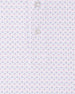 Detailed view of the Brookhurst Polo in Punch Pink geometric print with pink and blue diamond-inspired motifs