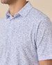 Collar detail of the Poker Dawgs Polo in Tidal Blue showcasing the allover poker-themed dog print