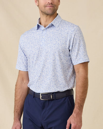 Poker Dawgs Polo in Tidal Blue with an allover poker-themed print, front model view
