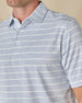 Close-up of the Oceano Dunes Striped Polo in Blue Shade, highlighting the fine horizontal stripe pattern, collar, and button placket.