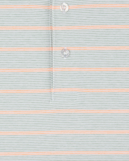 Detail view of the Oceano Dunes Striped Polo in Cantaloupe showing the fine horizontal stripe pattern, stitching, and branded buttons.