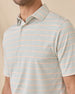 Close-up of the Oceano Dunes Striped Polo in Cantaloupe showing the collar, button placket, and fine sage green and cantaloupe stripe pattern.