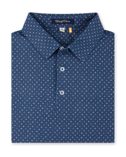 Close-up product view of the Casino Polo in Blue Shade, featuring an allover geometric pattern with small pastel playing card suit motifs, a classic collar, and button placket.